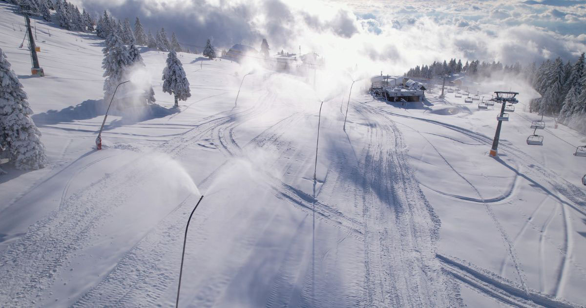Snowmaking systems operating at ski resort during winter season